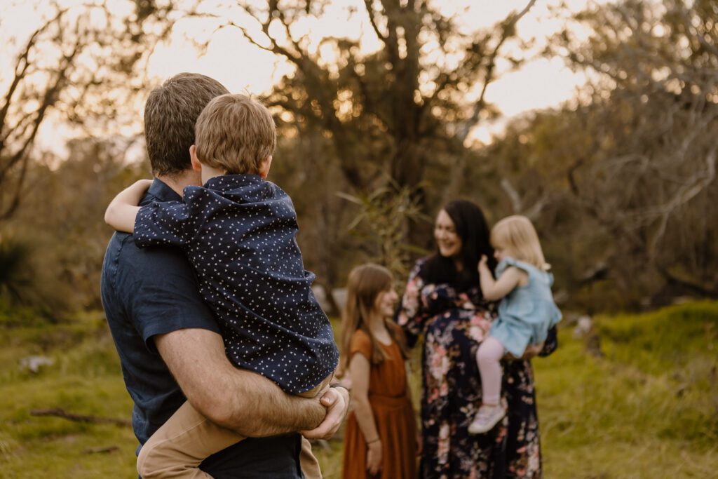 Perth family photographer guiding relaxed posing during lifestyle shoot